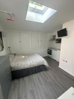 A modern double bedroom featuring a comfortable...