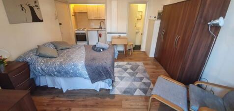 Well-appointed double bedroom featuring a comfo...