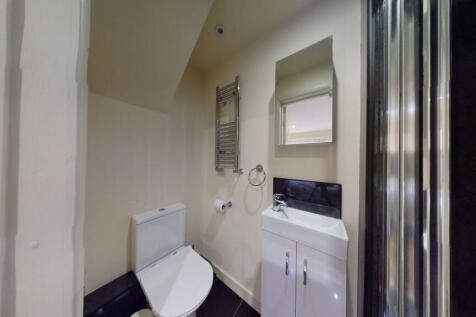 A modern and well-maintained single toilet feat...
