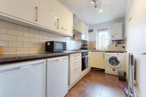 Modern kitchen featuring ample countertop space...