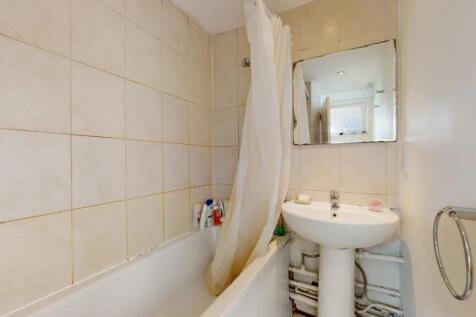 Bright bathroom suite featuring a full bath wit...