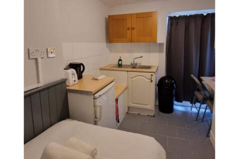 A compact and well-maintained kitchenette, perf...