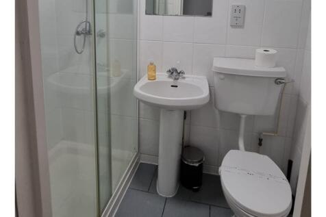 A tidy and functional bathroom featuring modern...