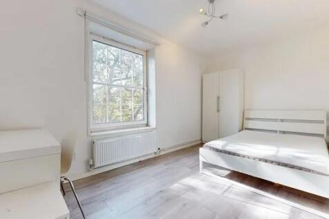 Bright and airy double bedroom featuring a larg...