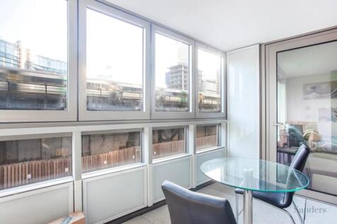 Bright and modern communal workspace featuring ...
