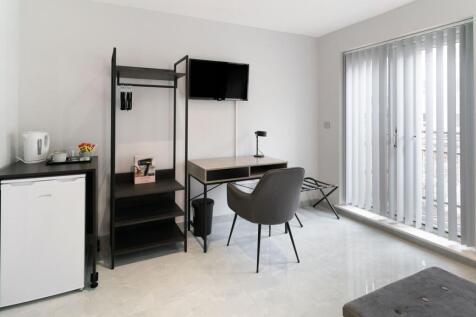 A modern and tidy communal workspace featuring ...