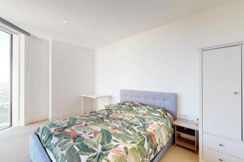 Bright and spacious master bedroom featuring a ...