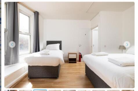 A bright and spacious double bedroom featuring ...