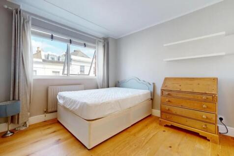Bright and cozy double bedroom featuring a comf...