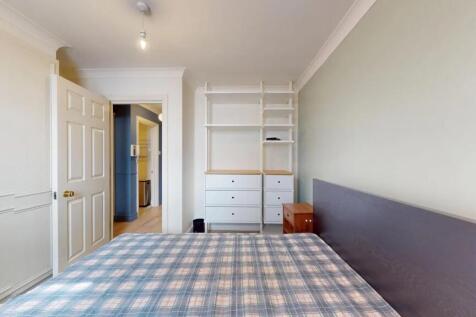 Bright and tidy double bedroom featuring a larg...