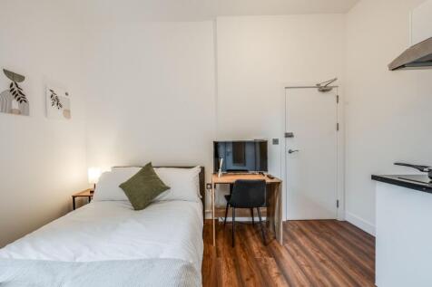 This charming double bedroom offers a cozy retr...