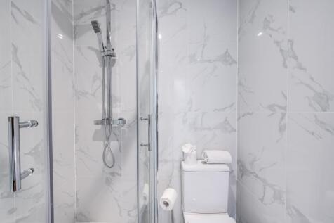 A modern and stylish bathroom featuring sleek m...