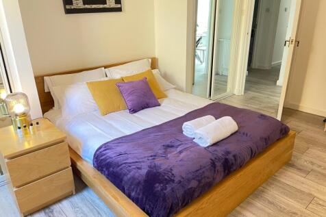 A beautifully decorated double bedroom featurin...