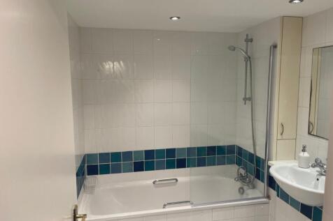 A bright and clean bathroom featuring a modern ...