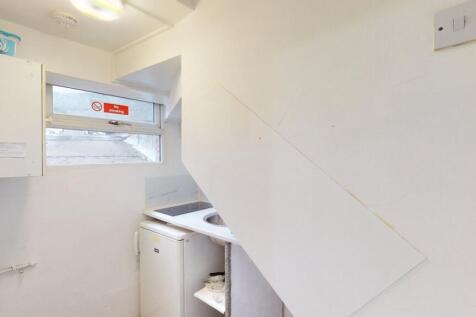 A compact and functional storage area with whit...