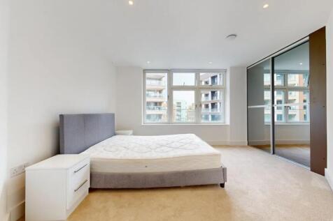 Bright and spacious master bedroom featuring a ...