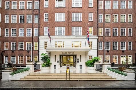 Elegant front entrance of a classic brick resid...