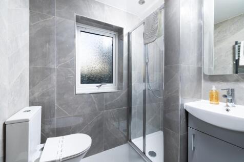 This modern bathroom features a sleek design wi...