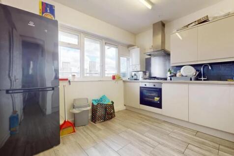 Modern kitchen with sleek cabinetry, built-in o...