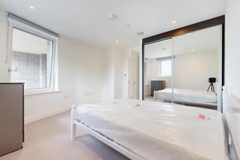 A bright and clean double bedroom featuring a l...