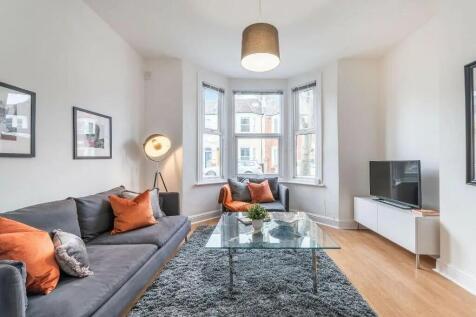 A bright and inviting living room featuring a l...