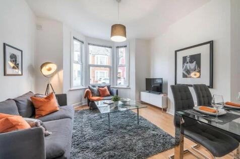 A stylish and inviting living room featuring a ...