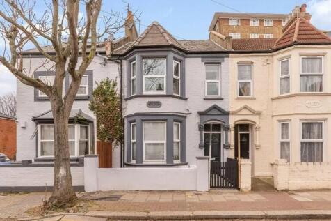 Charming terraced house featuring a classic bay...