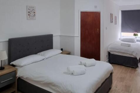 A spacious and inviting large double bedroom, p...