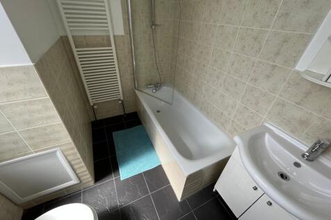 This well-maintained bathroom features a clean ...