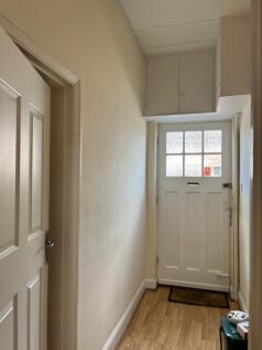 Welcoming hallway with natural light, featuring...