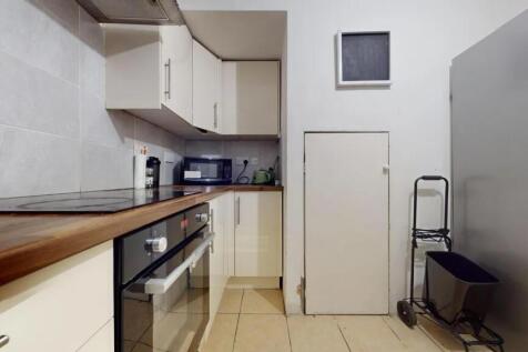 Modern kitchen featuring a sleek electric hob a...