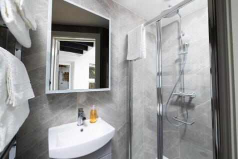 A beautifully designed bathroom featuring moder...