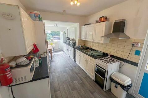 A bright and well-equipped kitchen with modern ...