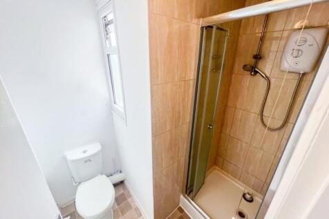 A clean and well-maintained bathroom featuring ...