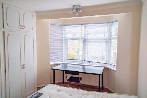 Bright and tidy double bedroom featuring a larg...