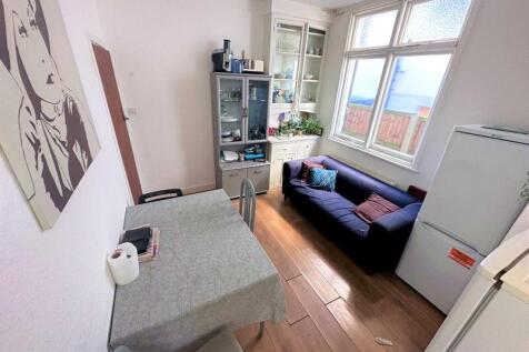 Bright and inviting living space featuring larg...