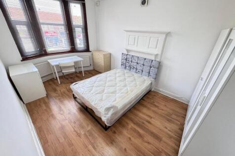 Bright and airy double bedroom featuring a comf...