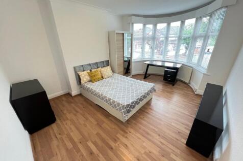 Bright and spacious master bedroom featuring a ...