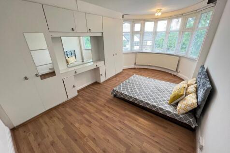 Bright and spacious master bedroom featuring a ...