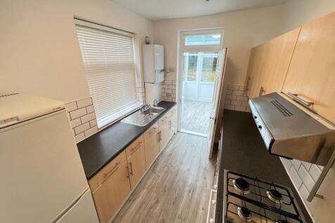 Bright and tidy galley kitchen featuring ample ...