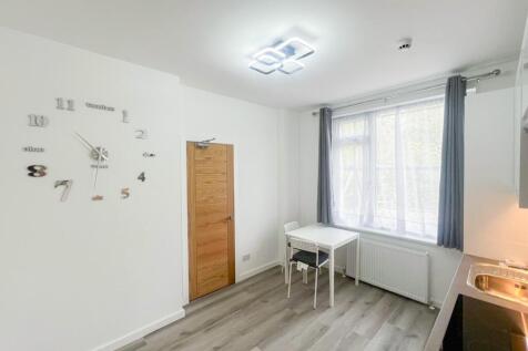 Bright and tidy kitchen featuring modern finish...
