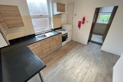 Bright and clean kitchen featuring modern wood-...