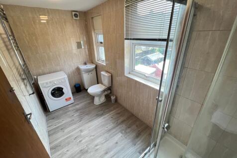Bright and well-maintained bathroom featuring a...