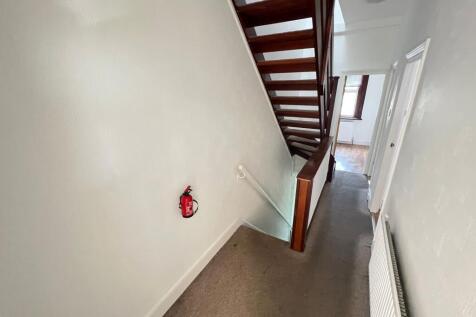 A clean and well-maintained hallway with neutra...