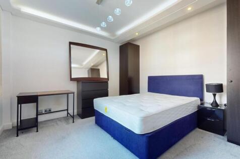 A modern double bedroom featuring a comfortable...