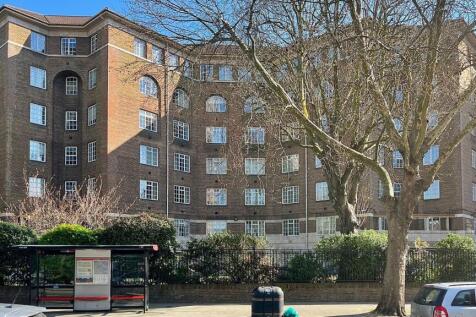 A well-maintained front view of a classic brick...