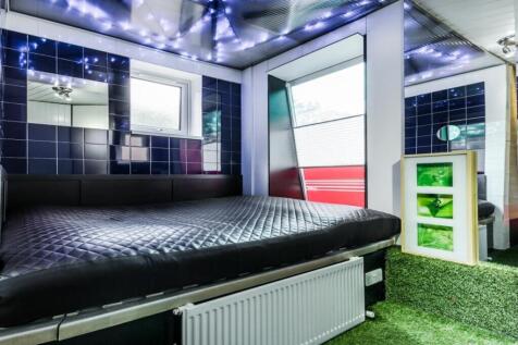 A stylish and inviting large double bedroom fea...