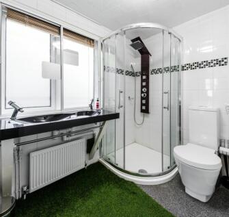 A modern and clean bathroom featuring a stylish...