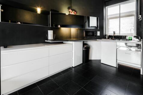 A modern and stylish kitchen with ample storage...