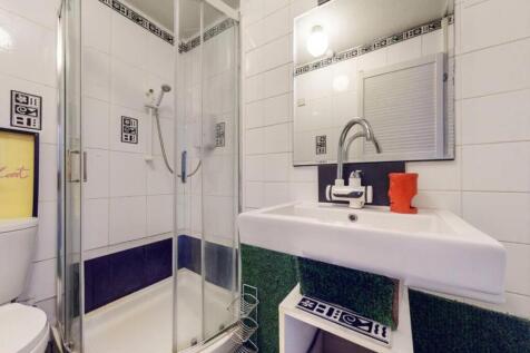A modern bathroom featuring a sleek shower and ...